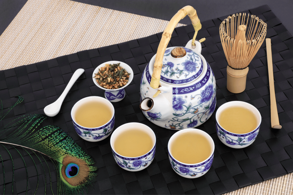 a teapot with cups of genmaicha brown rice tea