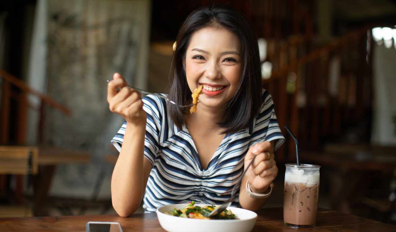 woman eating at restaurant