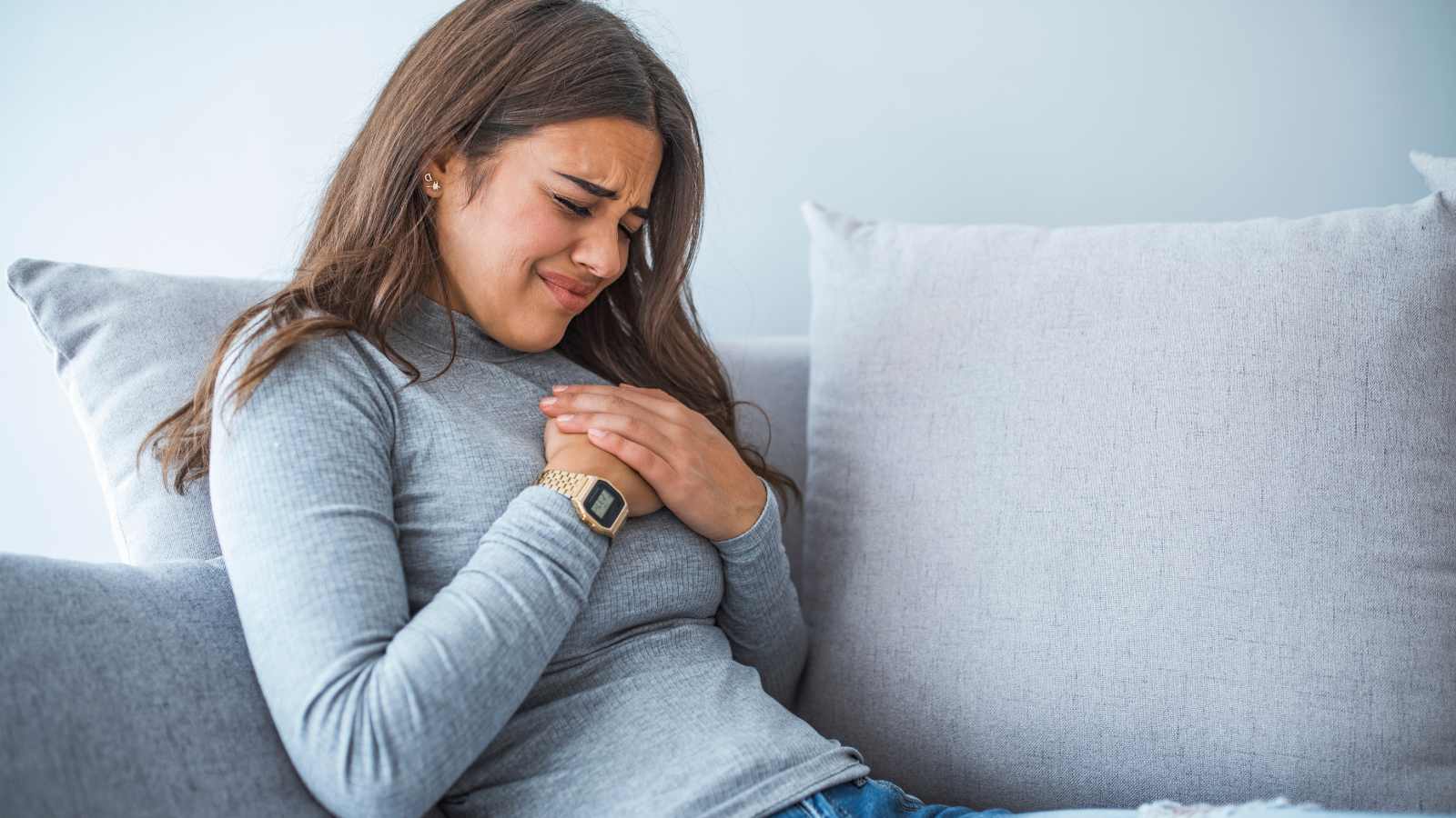 woman suffering from chest pain