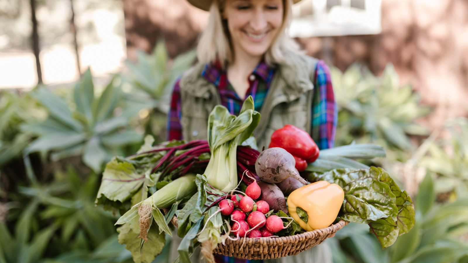 A lady holding farm produce