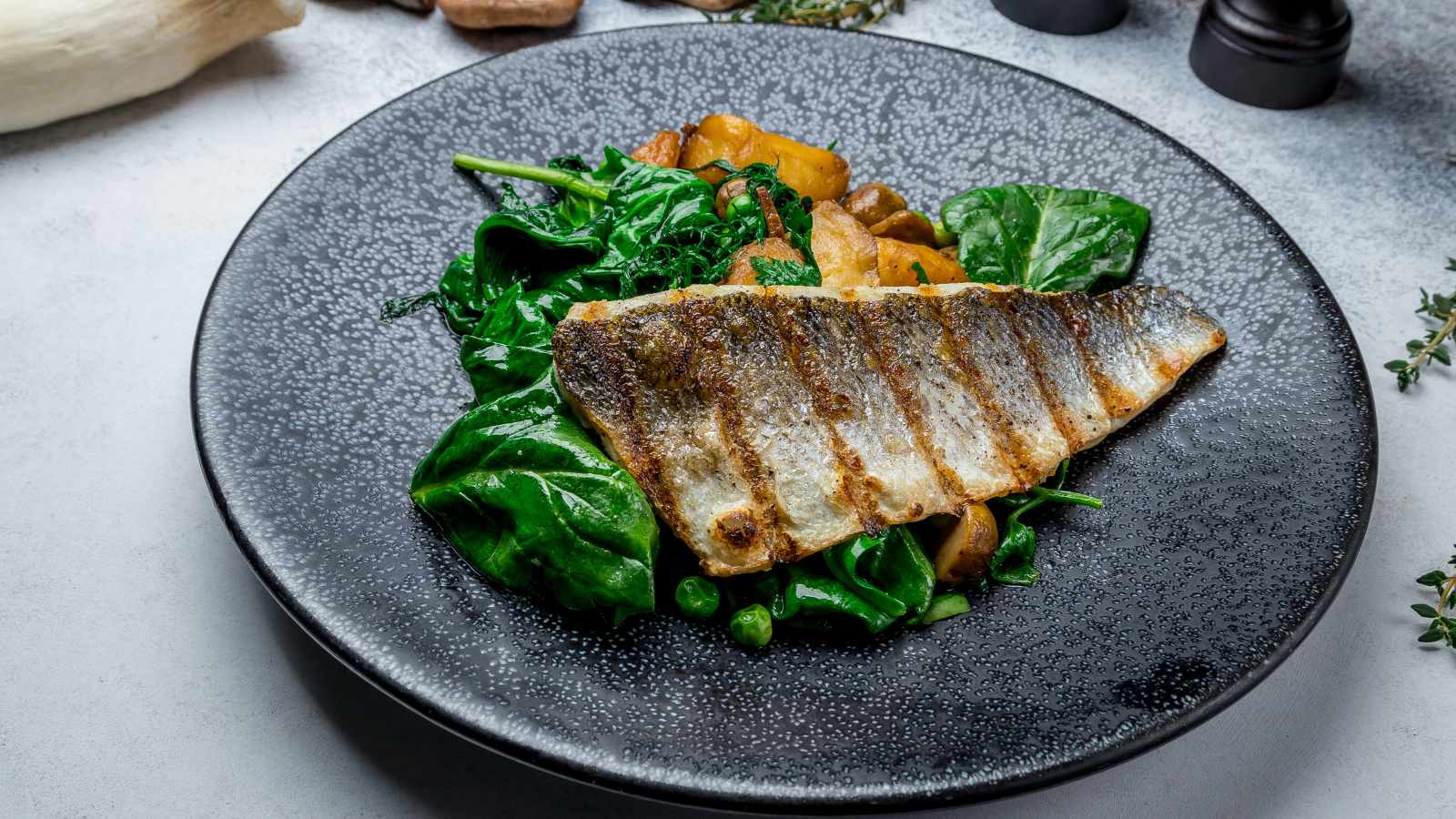 Fried sea bass on a plate