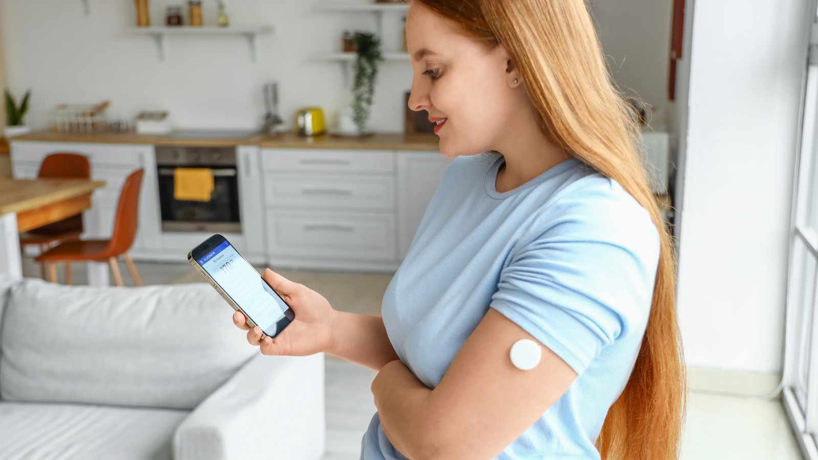 Lady checking blood sugar level at home