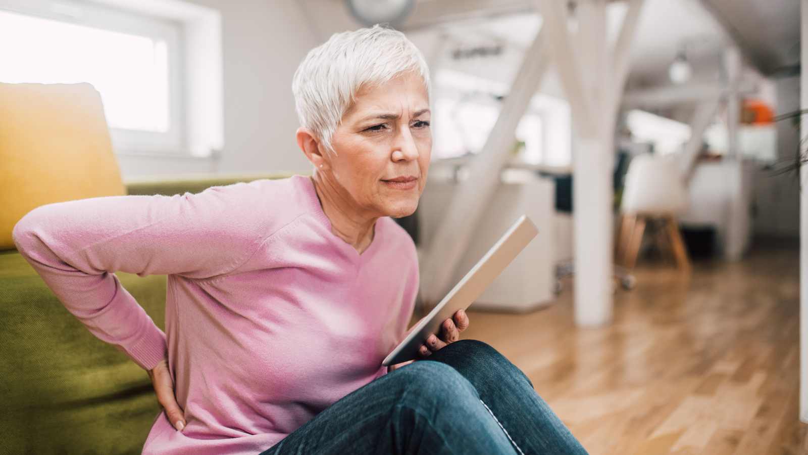 older woman having back pain