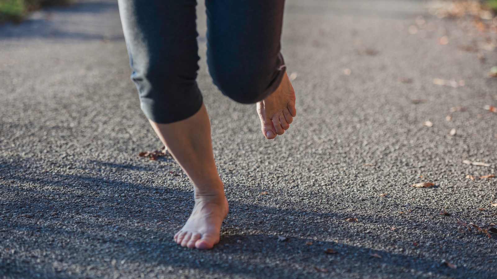 woman running barefoot