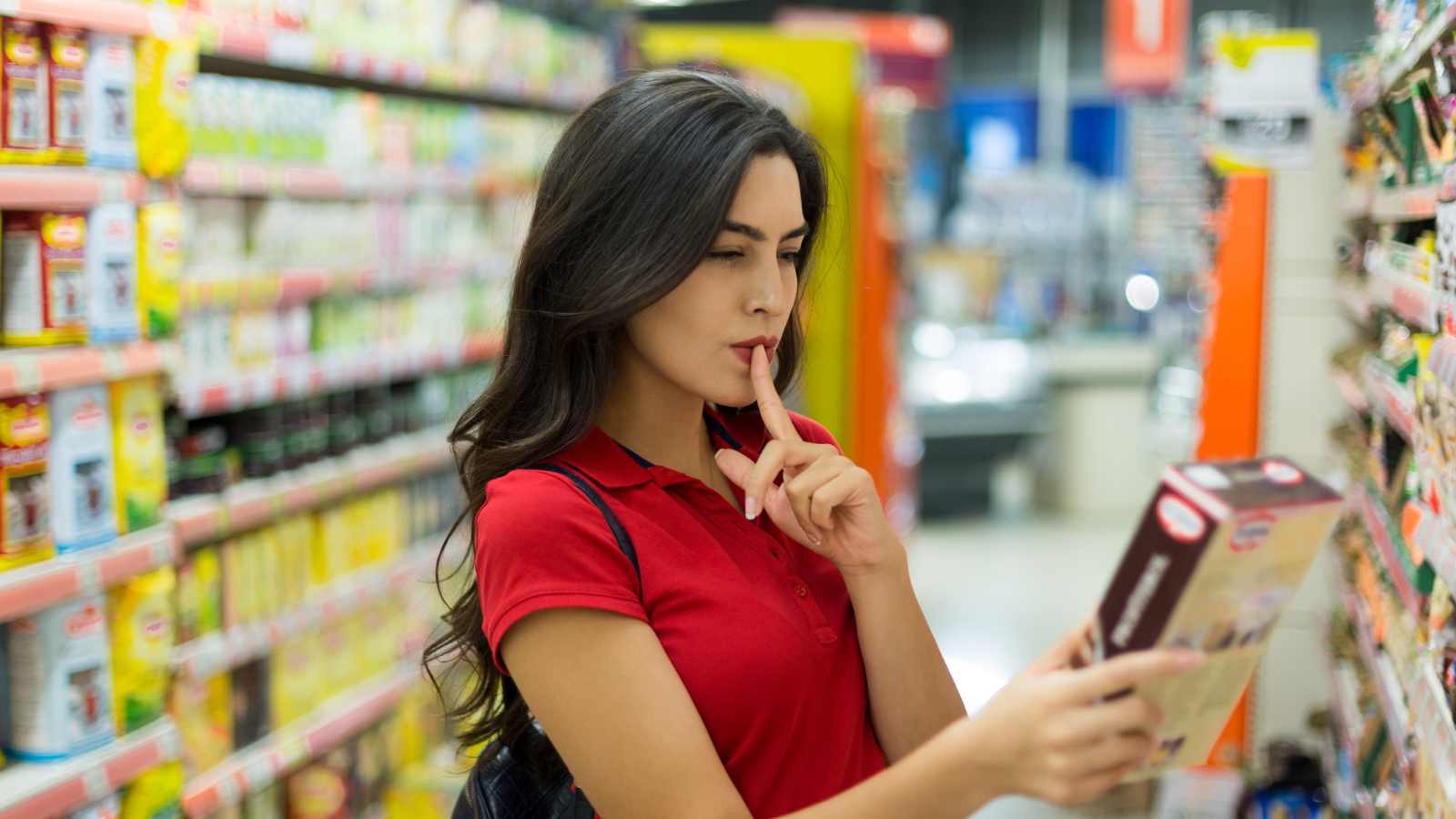 young woman reading food labels