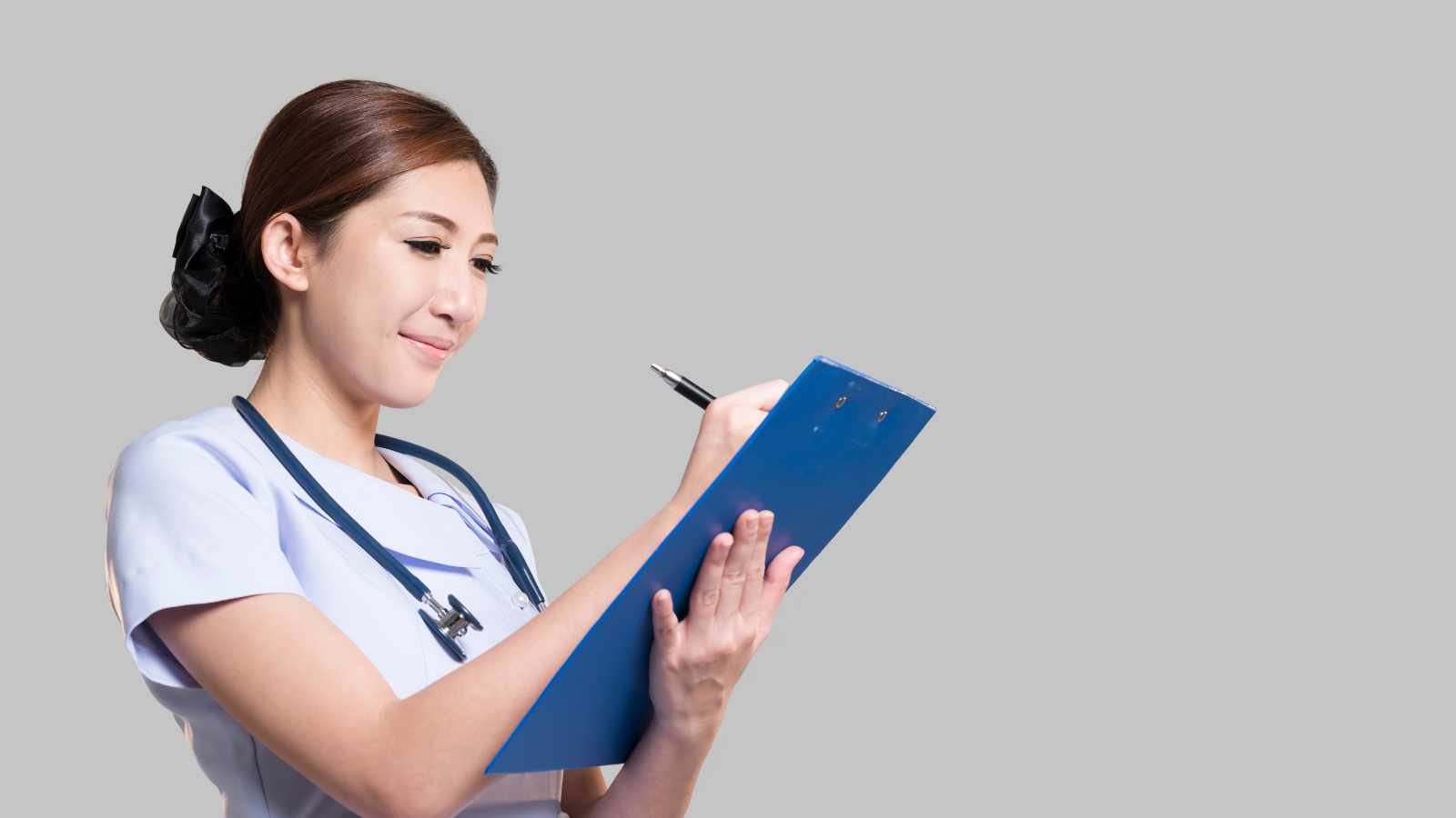 Nurse filling a medical record
