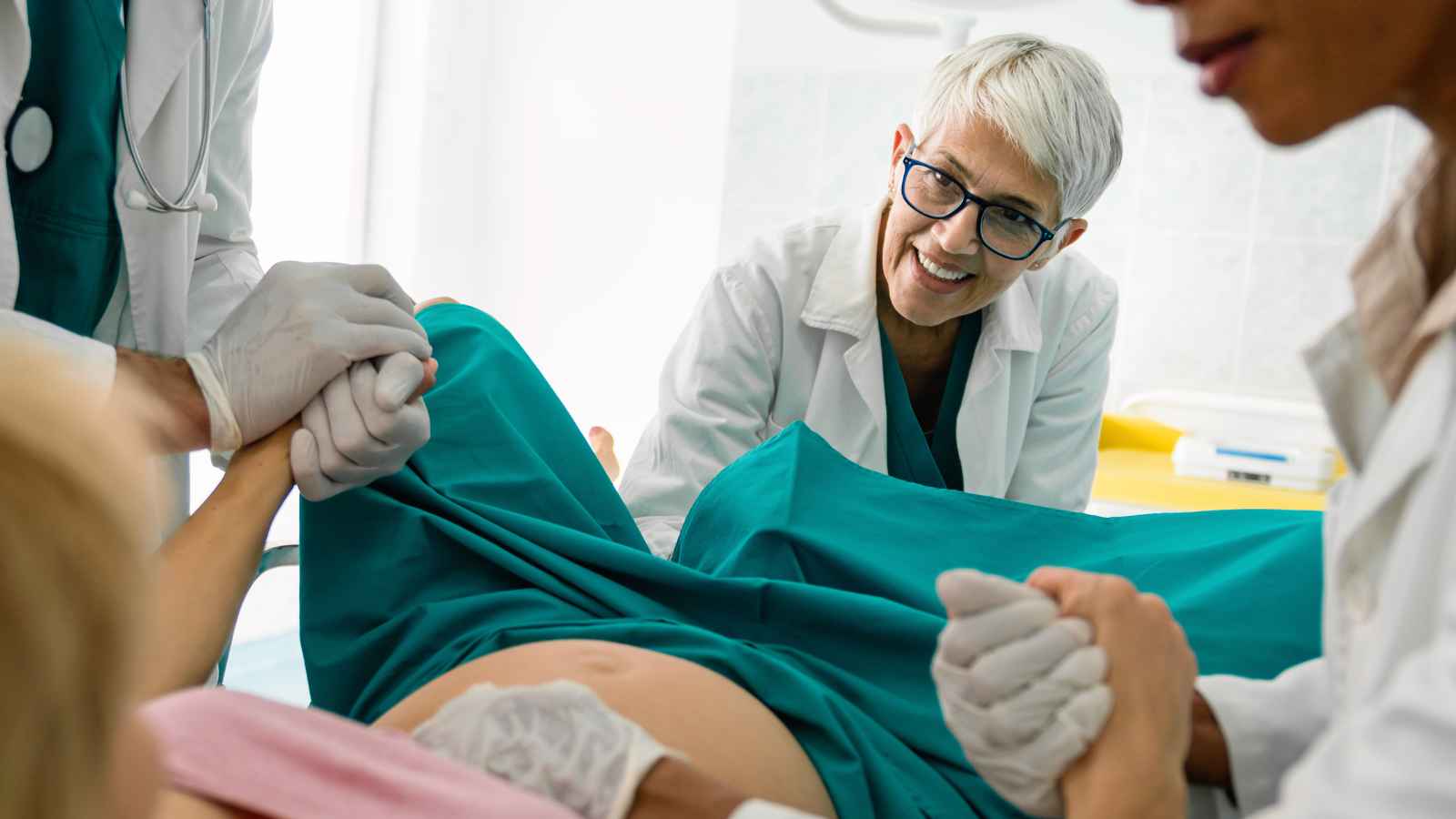 doctor helping a woman in labor