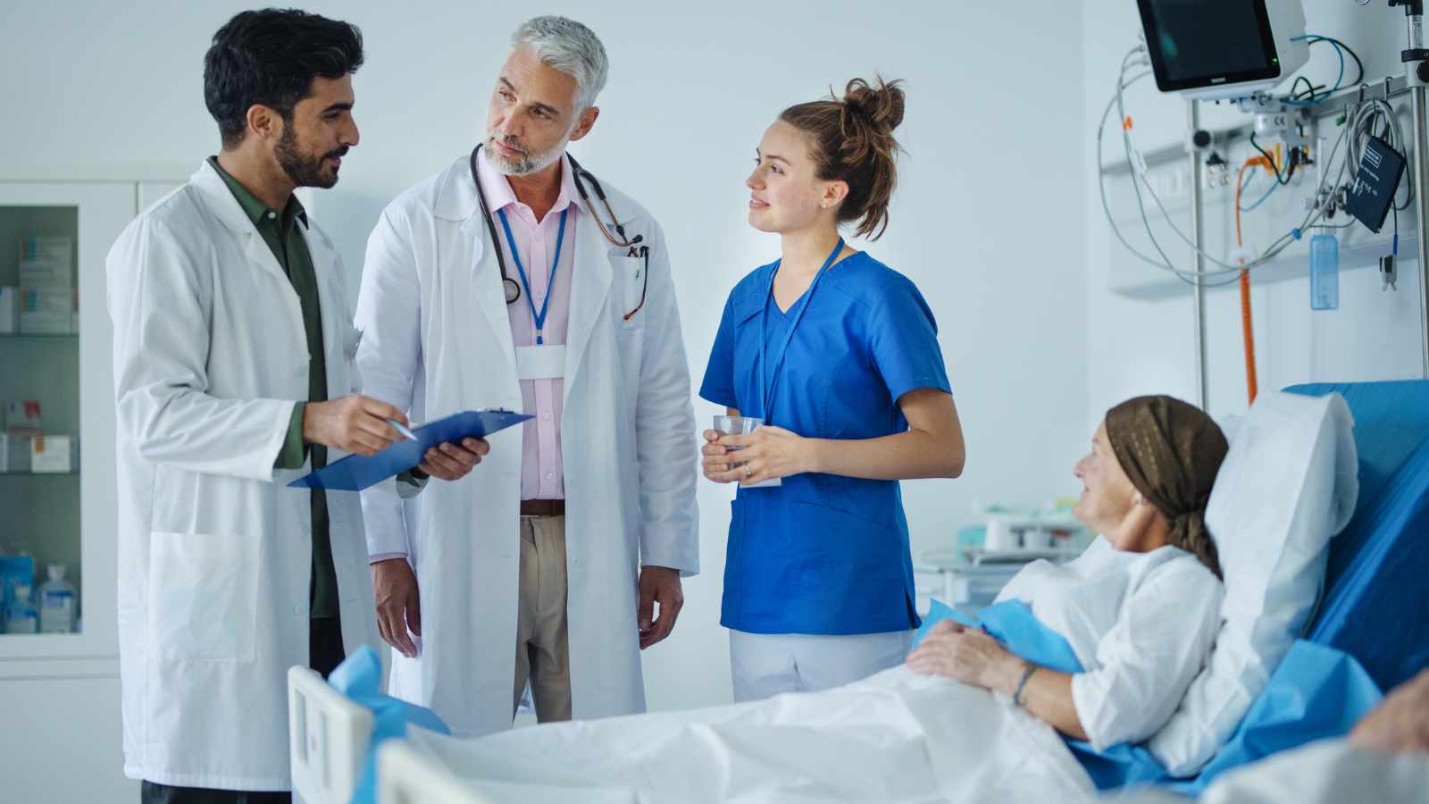 doctors chatting with a patient