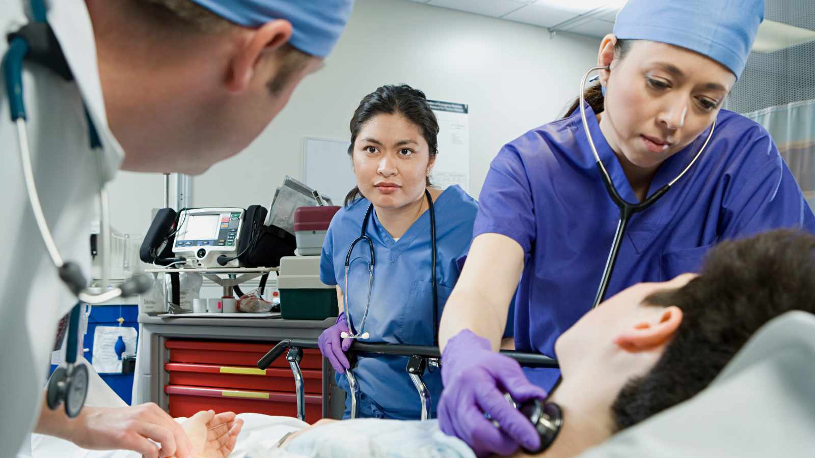 doctors treating a patient
