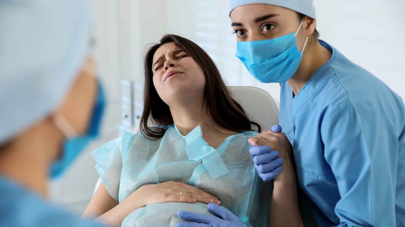 pregnant woman in pain in delivery room