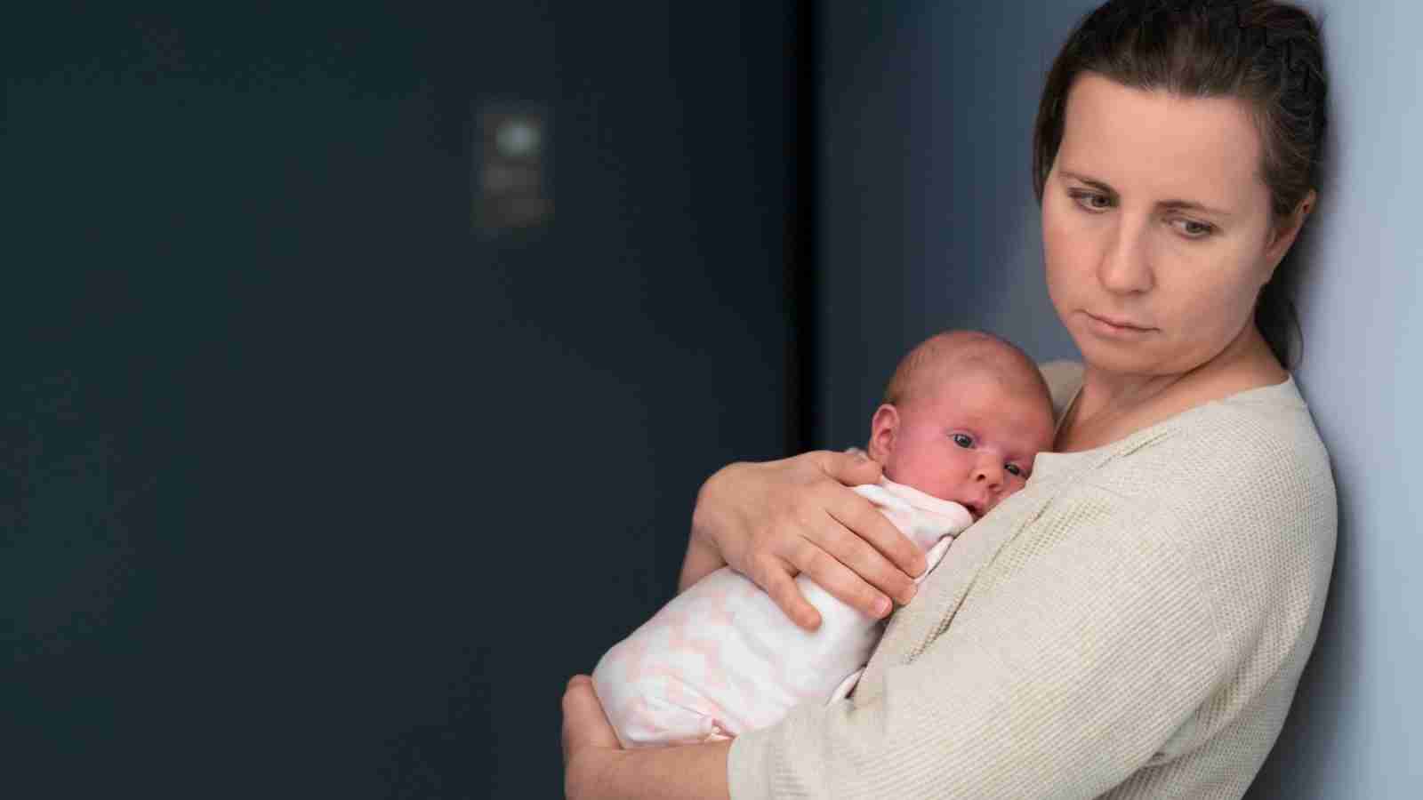 sad woman with baby