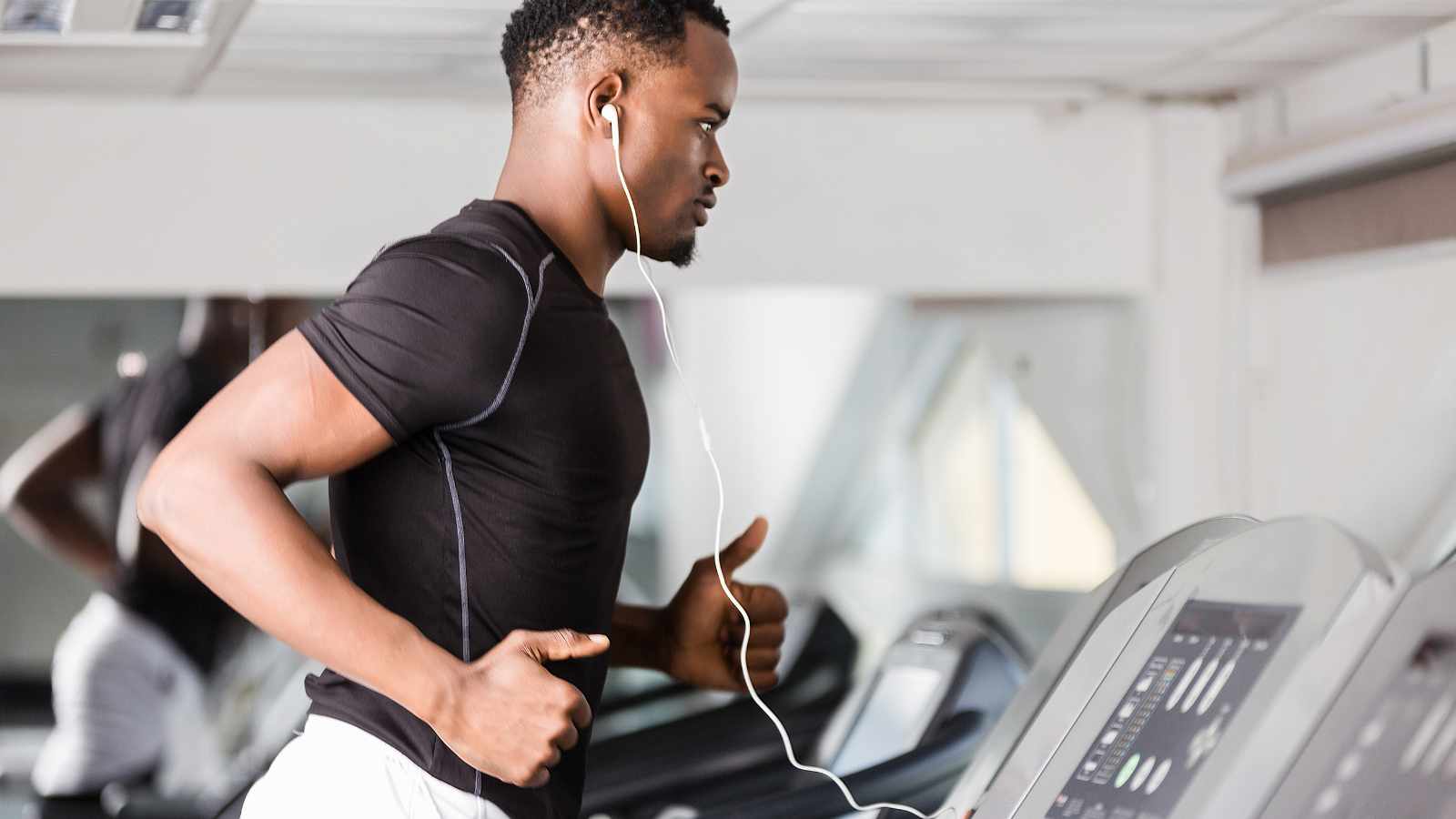 Man with an earpiece at the gym
