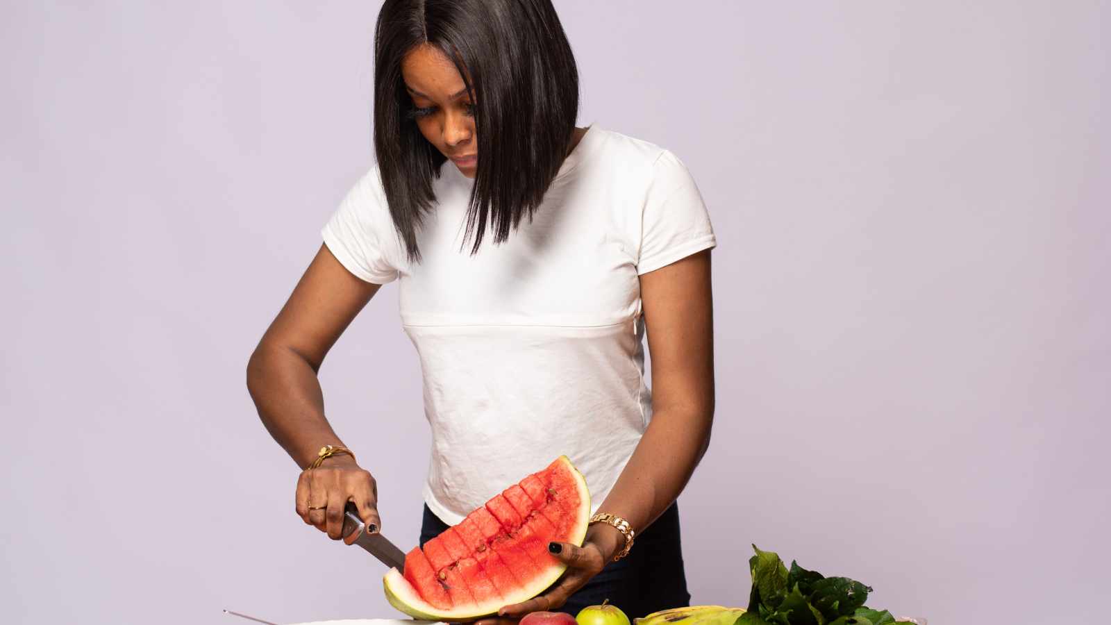 lady cutting water melon
