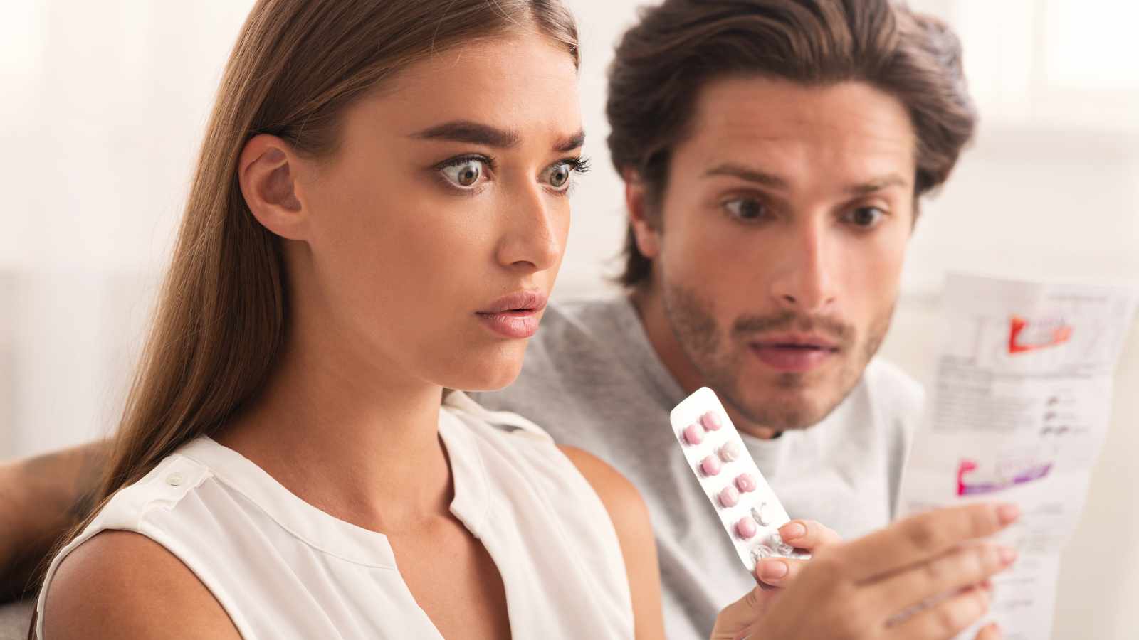 shocked lady looking at pills