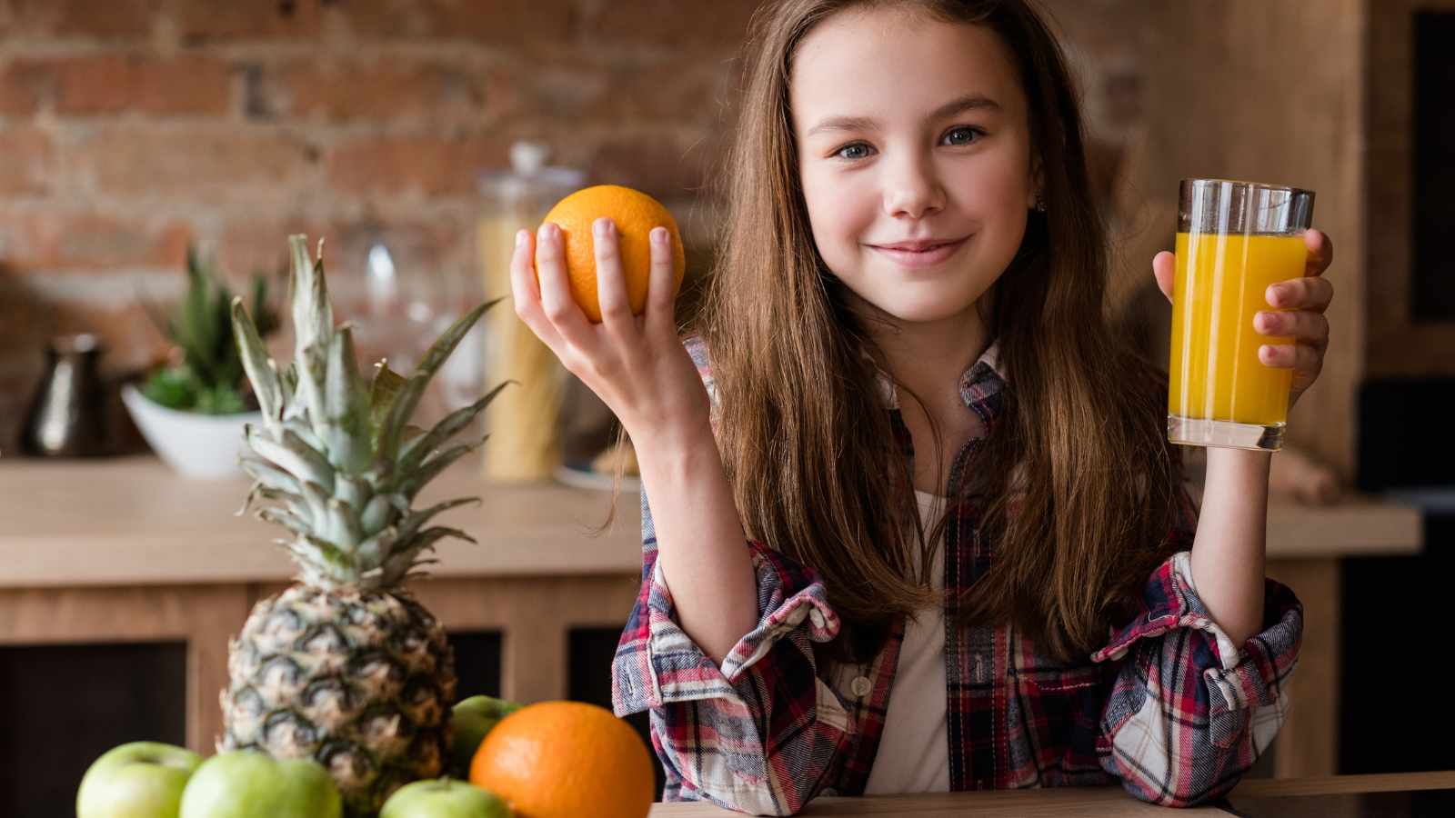 Girl holding fruit juice