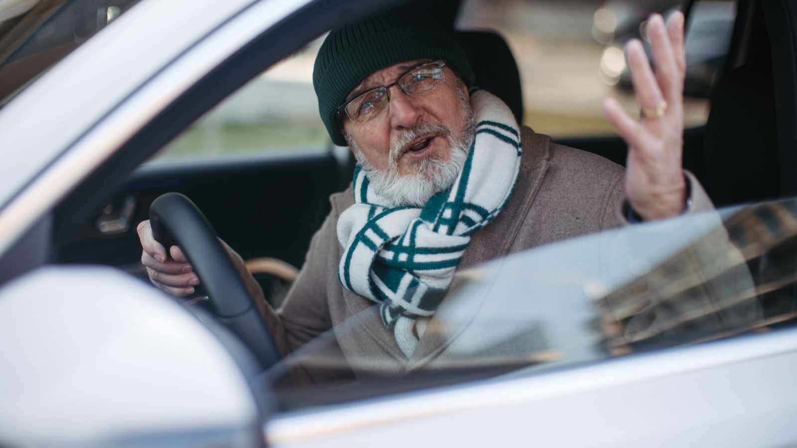 angry senior driving car