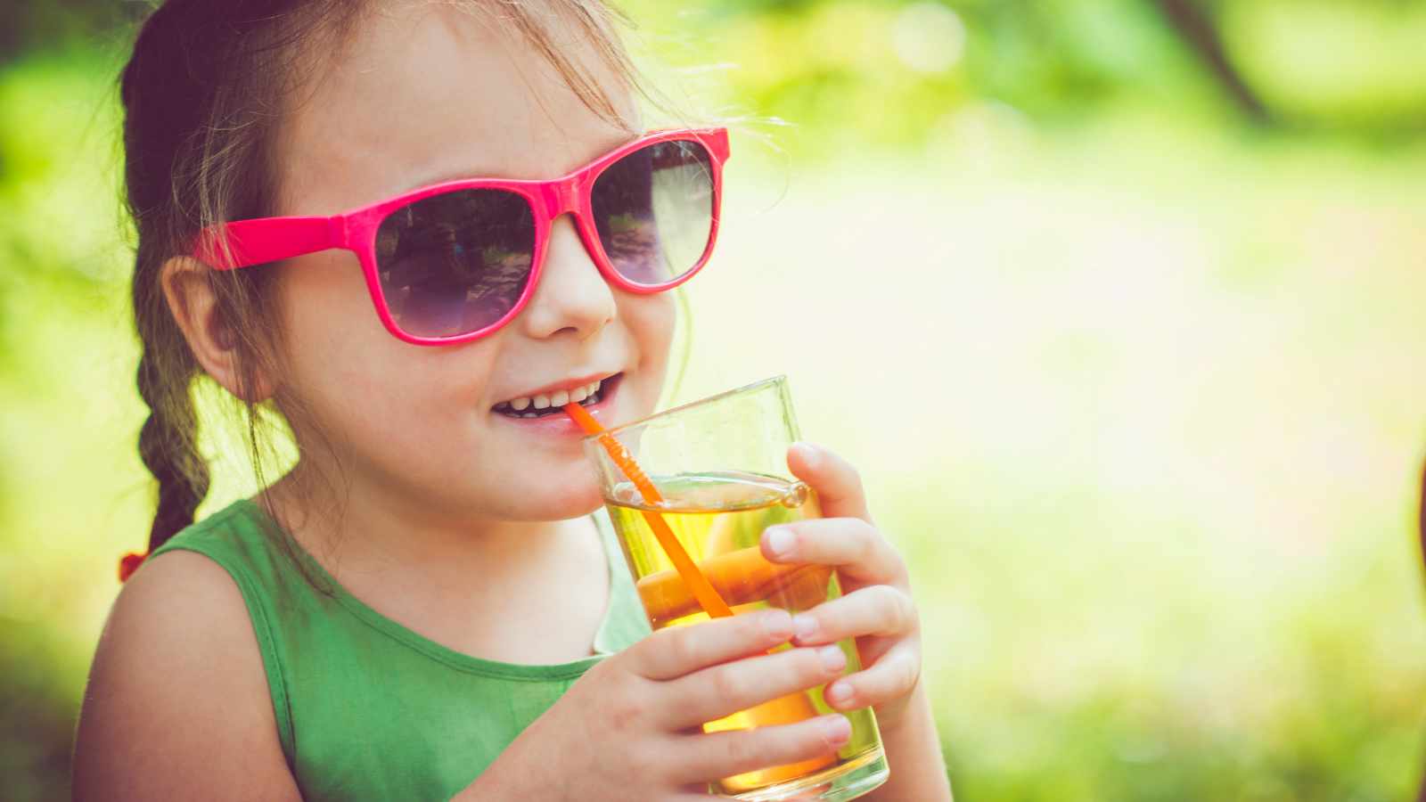 child drinking soda