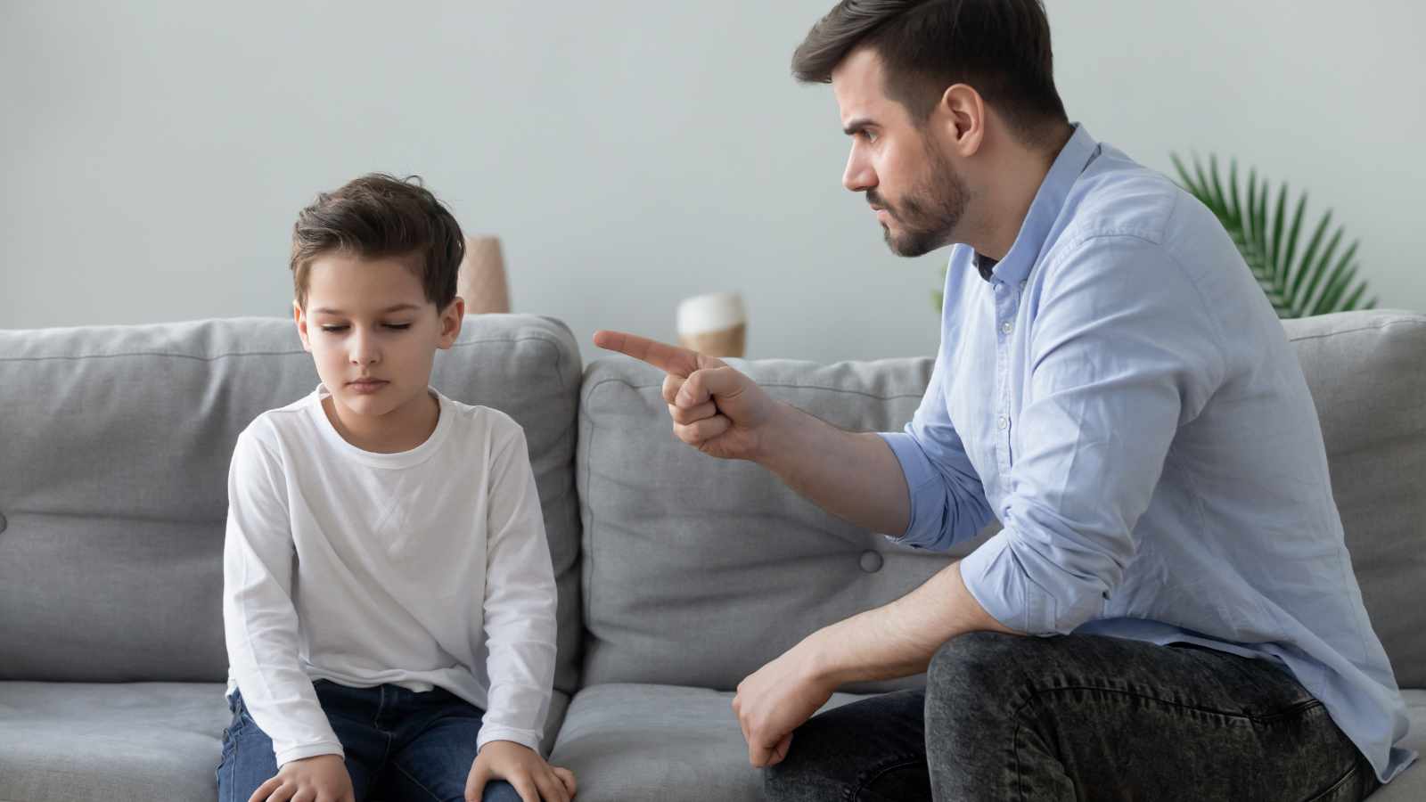 Angry man scolding a boy