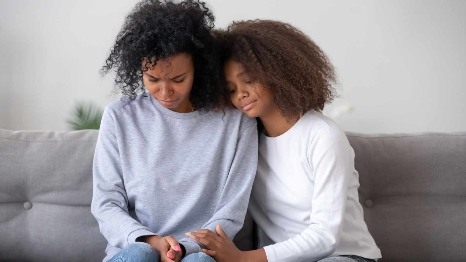 Girl consoling her mother