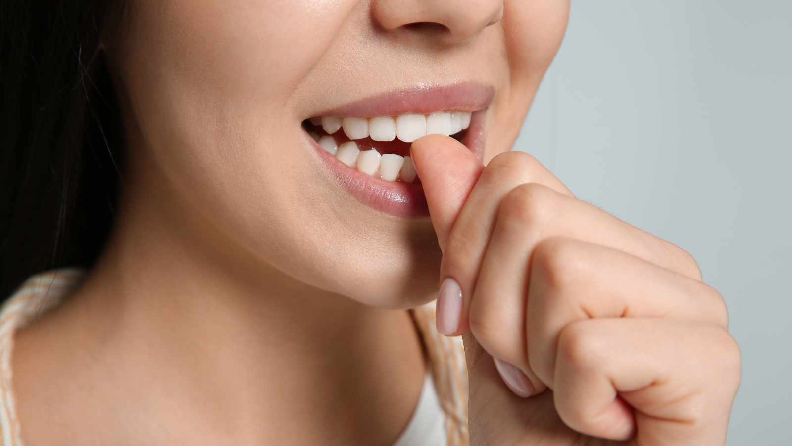 Lady biting her nail