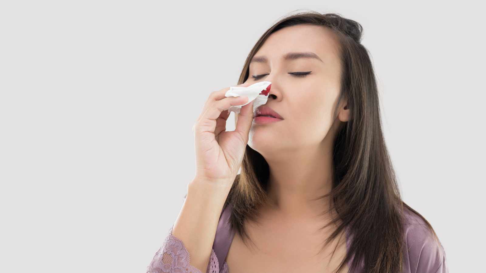 Lady bleeding from nose