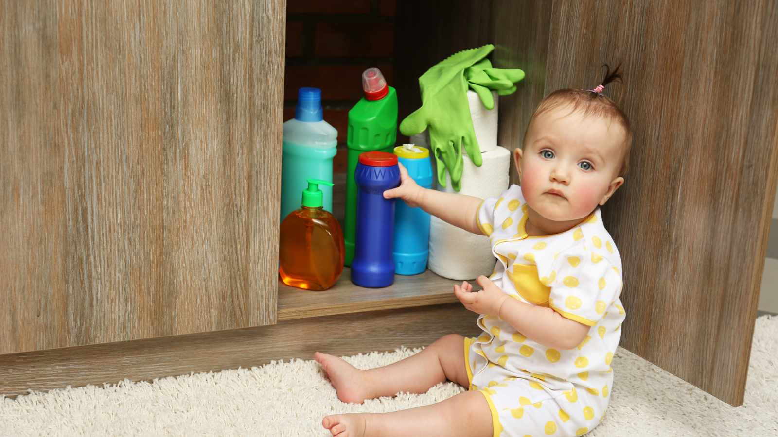 Little girl playing with detergents
