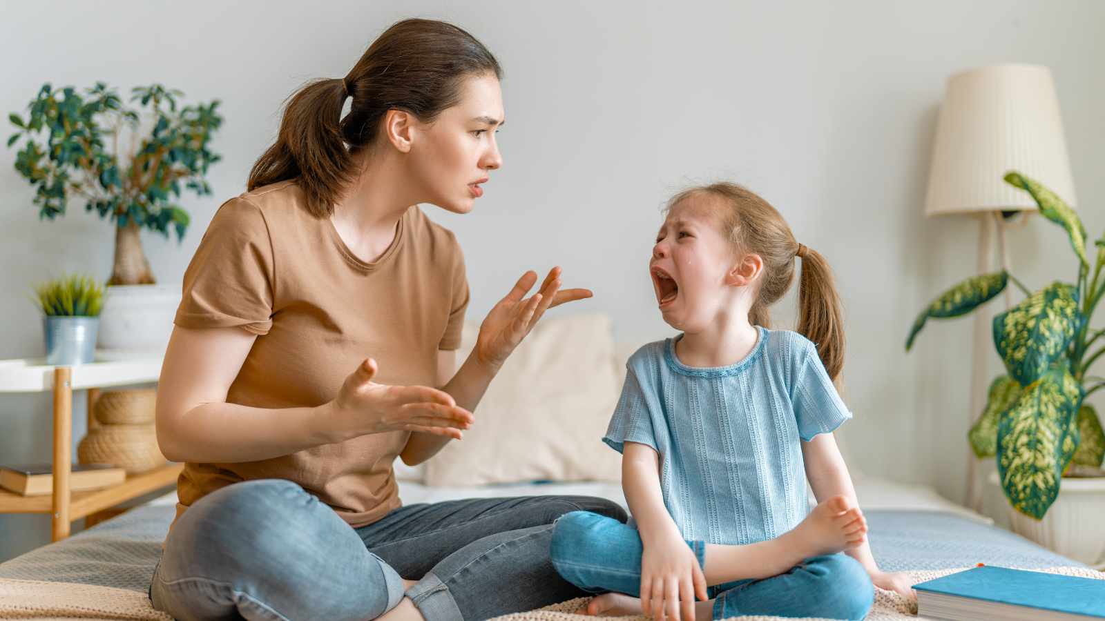 Woman making a child cry