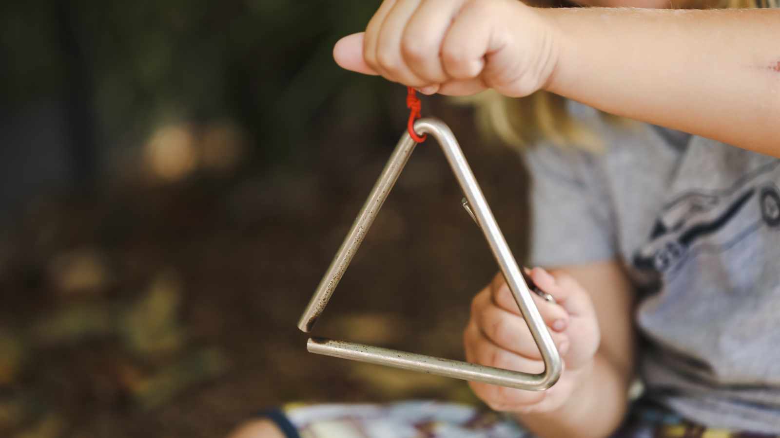child playing with dangerous toy