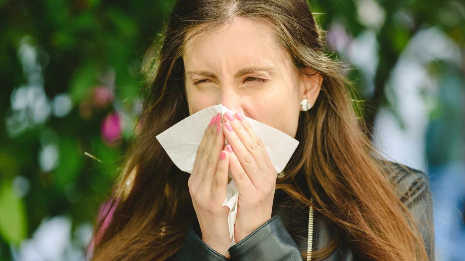 woman blowing nose