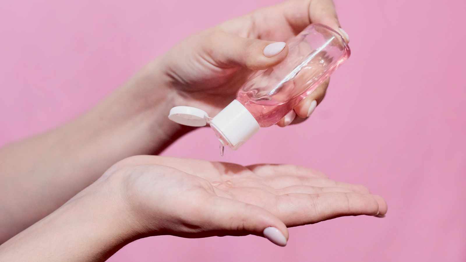 Lady using hand sanitizer