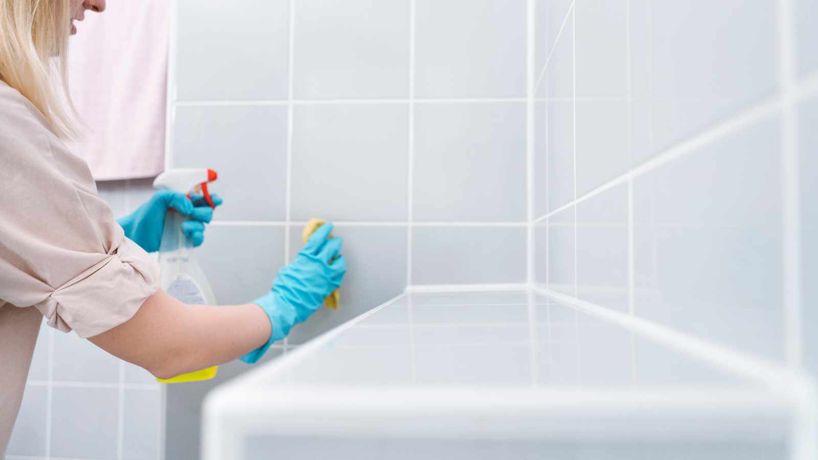 Woman cleaning bathroom
