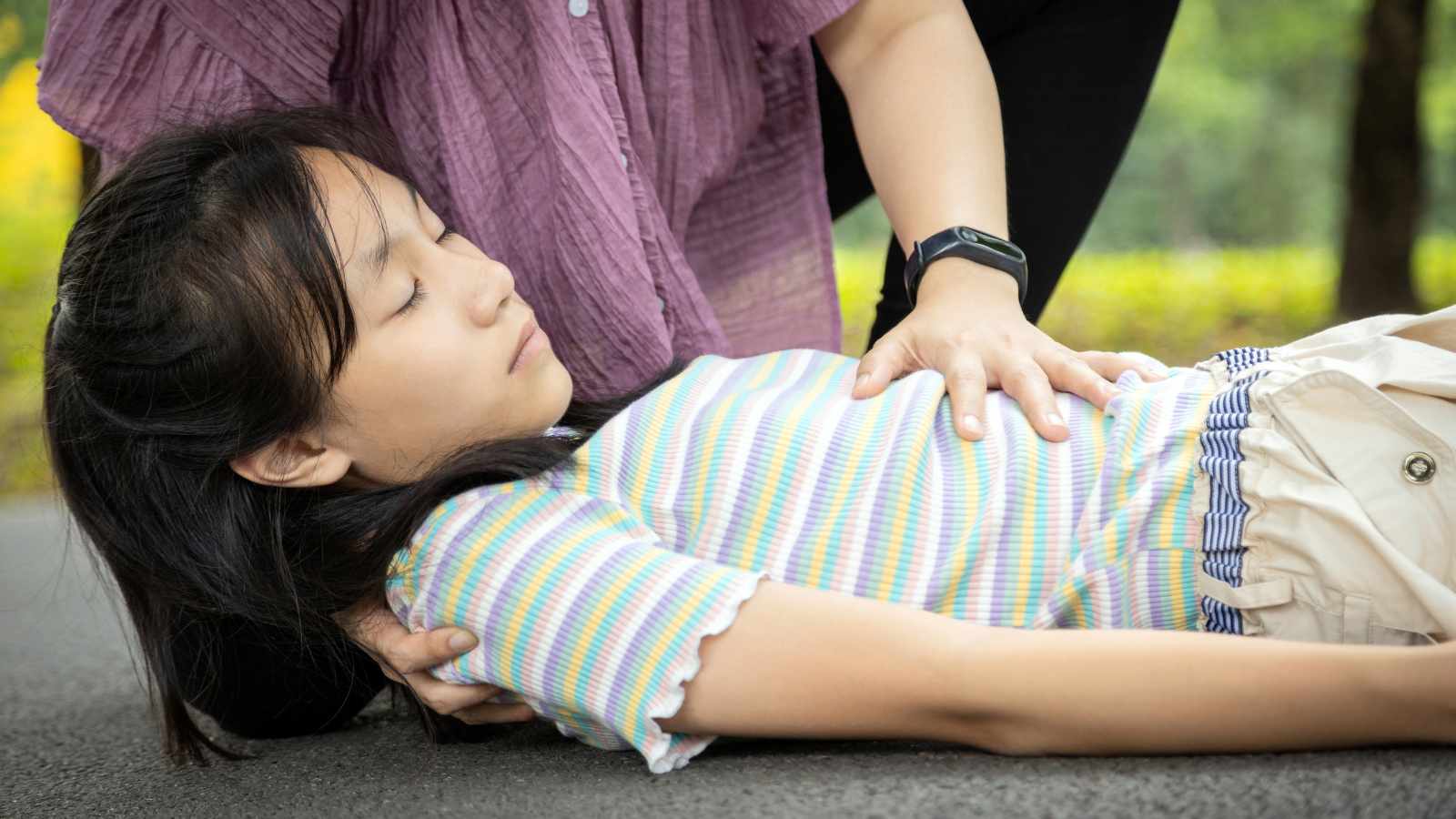 A lady lying flat during a heart attack