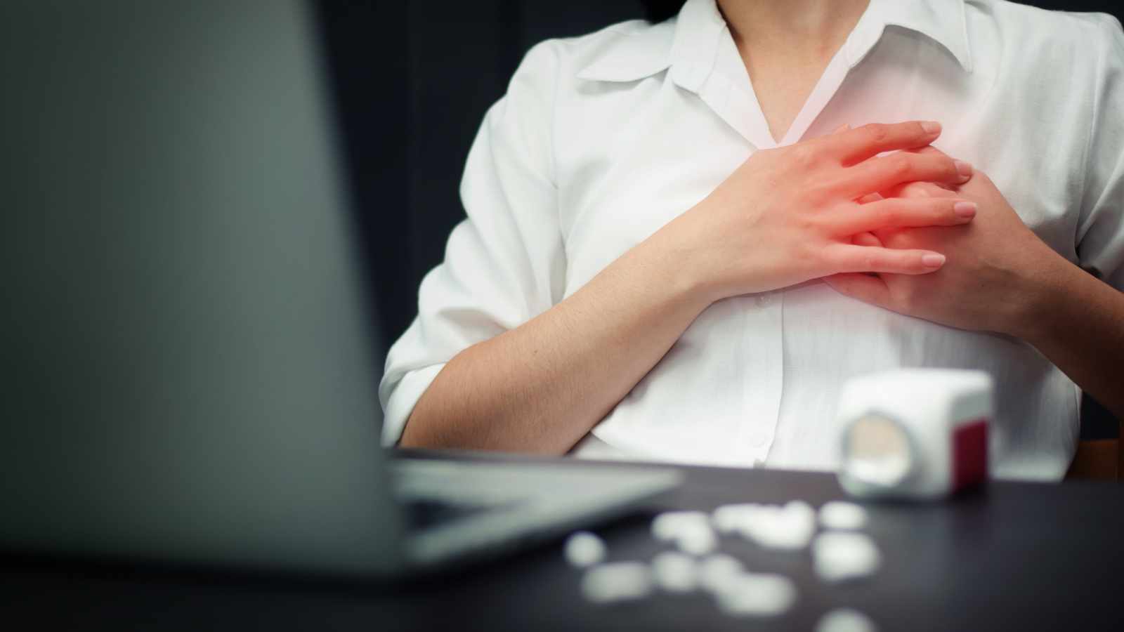 A man trying to take aspirin during a heart attack