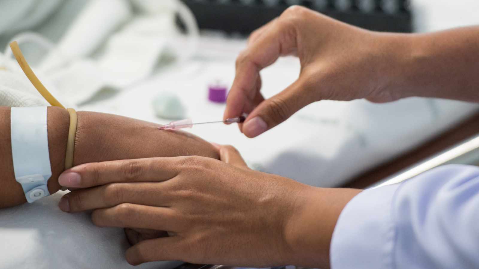 Nurse performing phlebotomy