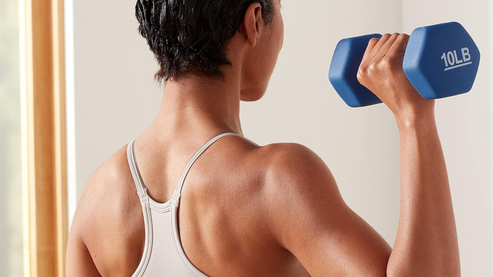 woman exercising with a dumbbell