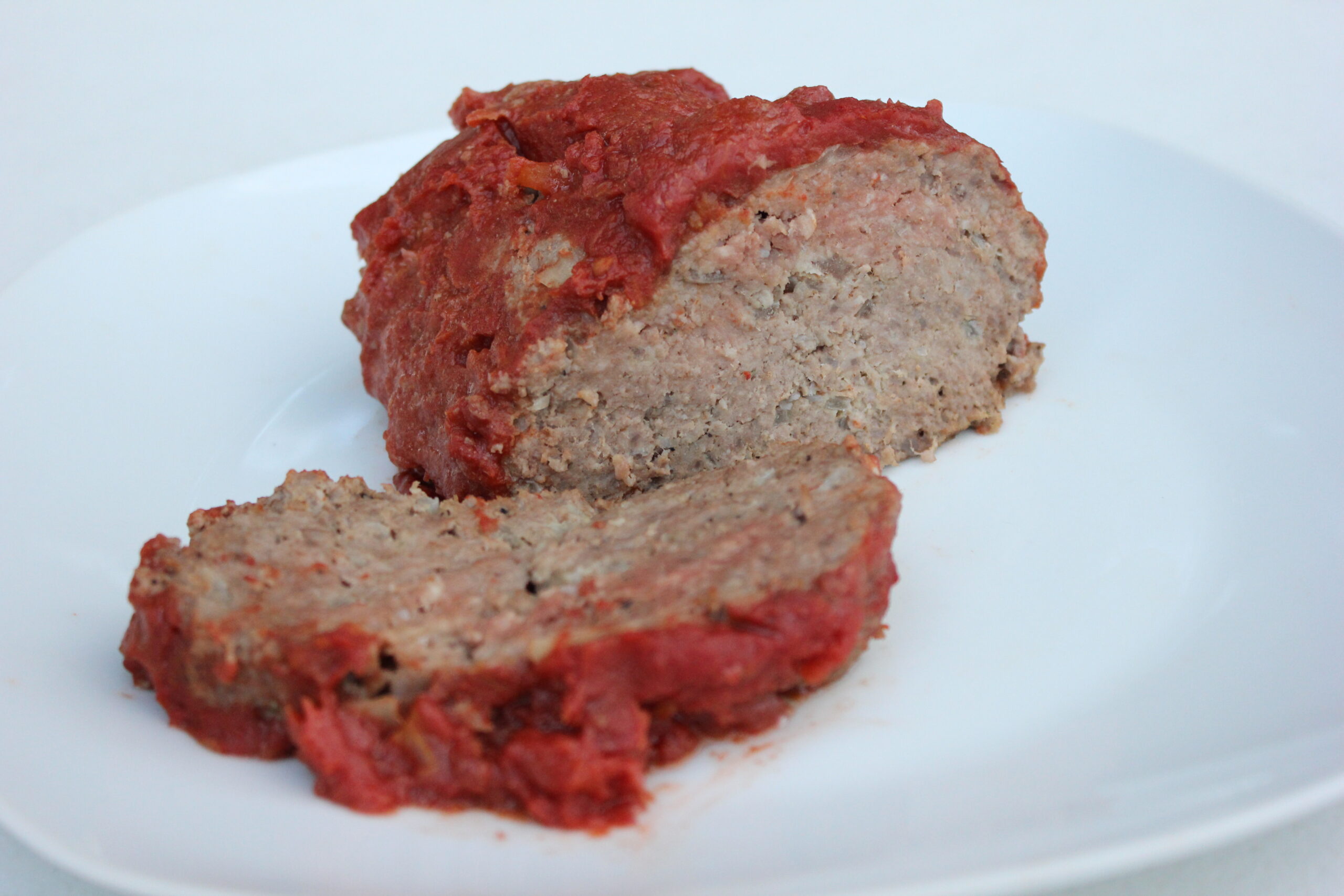 Meatloaf on white plate scaled